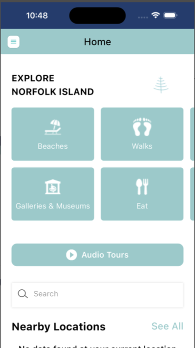 Home screen with the Explore Norfolk Island category grid for Beaches, Walks, Galleries & Museums, and Eat, plus Audio Tours and Nearby Locations.